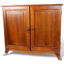 A modern walnut table-top collector's cabinet, the panelled doors opening to reveal 7 fitted