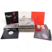 A quantity of vinyl LPs and 12" singles, various artists and genres, including Woody Guthrie,