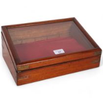 A small Victorian table-top display cabinet of canted sloped form, and fitted drawer, recessed brass