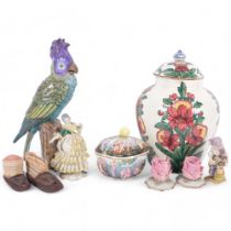 A Continental porcelain perching cockatoo, 29cm, and a glazed terracotta pot and cover painted