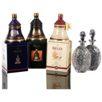 3 boxed Bell's commemorative Whisky decanters, including Christmas decanter (all full)