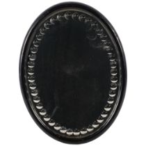 Antique oval ebony framed sorcerer's mirror, H32cm