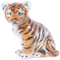 An Italian ceramic study of a seated tiger cub, H33.5cm
