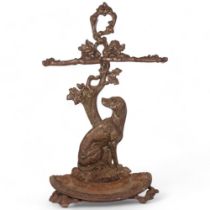 A Victorian cast-iron stick stand, with dog and foliate support, H72cm