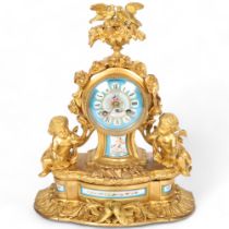 An Antique French ormolu mantel clock, with a blue ceramic dial and black Roman numerals, with
