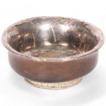 An early 20th century Indian white metal and wood bowl