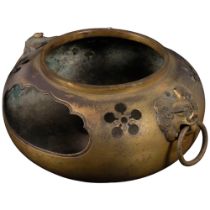 A Chinese bronze censer with dog of faux ring handles, diameter 20cm