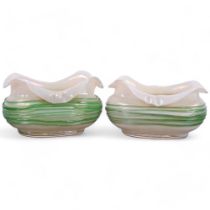 A graduated pair of Loetz iridescent glass bowls, with trailed green glass decoration, largest