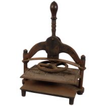 A 19th century cast-iron book press, with turned wood handle, H47cm