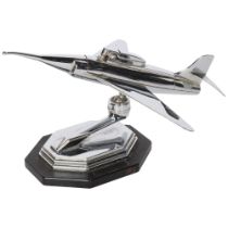 A Vintage chrome plate table lighter in the form of a jet aeroplane on stand