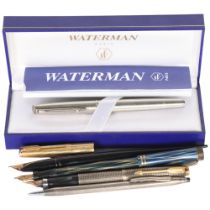 A group of various pens, including a boxed Waterman, a Canadian Lucky Curve fountain pen with gold