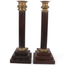2 similar composition reeded candlesticks on stepped plinths, with brass mounts, height 43cm