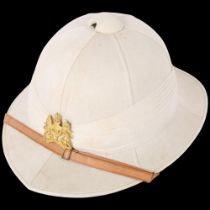 A Royal letters patent "Comfortease" pith helmet, size 7 and 1/8 full