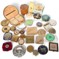 A collection of compacts, including silver foil, needlepoint, evening bag, etc