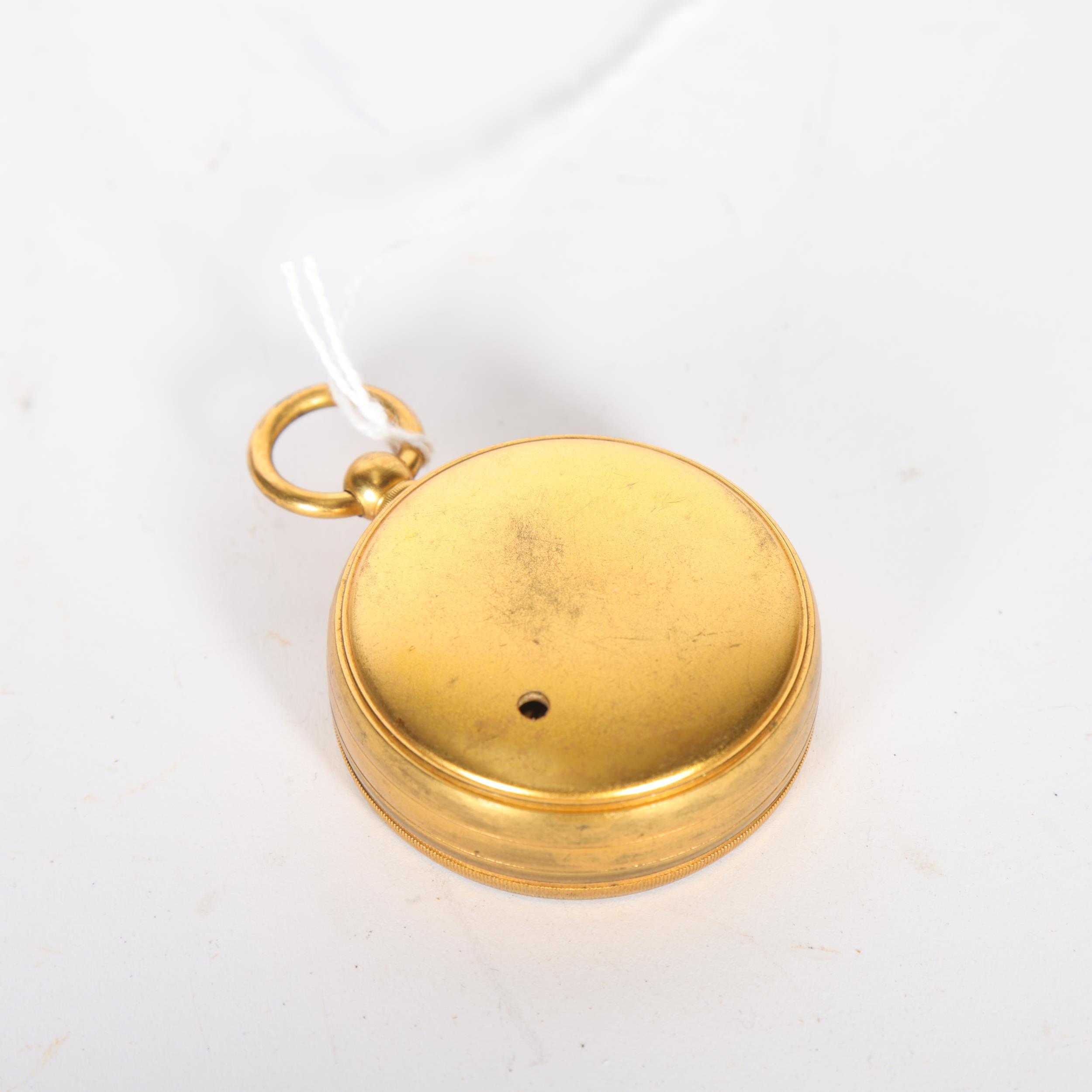 NEGRETTI & ZAMBRA - a gilt-metal pocket barometer, serial no. 29506, diameter 5cm - Image 2 of 2