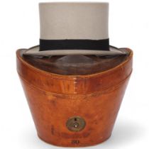 A Victorian brown leather hat box and lid, by John Pound & Company, Leadenhall Street, with red silk