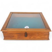 A stained pine-framed table-top jewellery display cabinet, with hinged glazed lid, 43cm x 11cm x