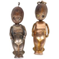 Two First World War period "Fumsup" good luck charms, silver and gold plated, with moving arms,