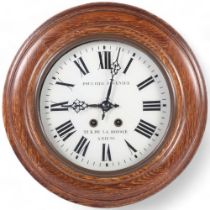 An oak-cased dial wall clock "Poultier Fournier 21R.De La Hotoie, Amiens", sprung movement, face