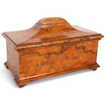 An early 19th century burr-walnut tea caddy of sarcophagus form, with fitted lidded boxes (no mixing