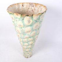 A terracotta glazed conch shell stick stand, H57cm