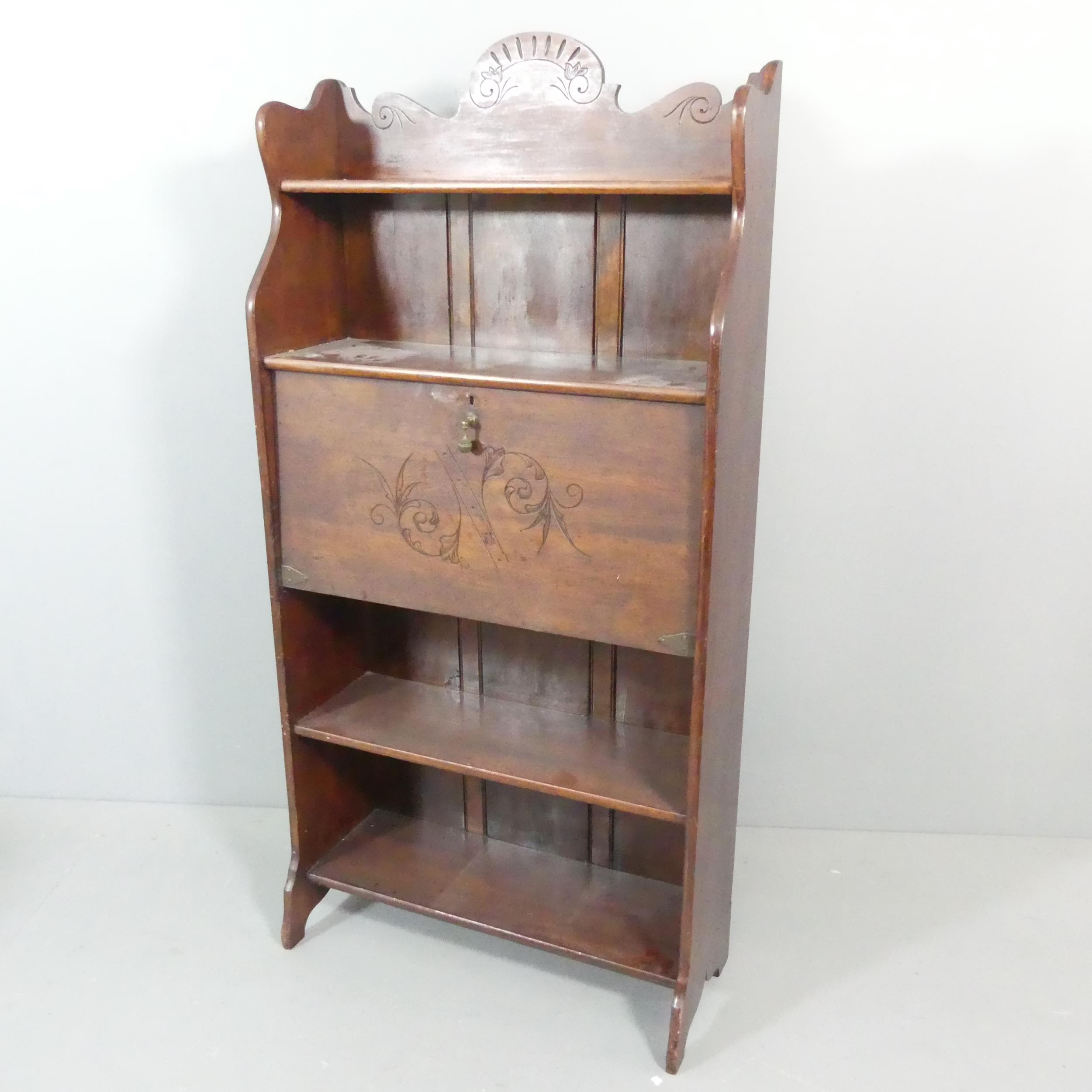 An early 20th century mahogany student's bureau. 75x155x31cm.