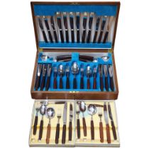 THOMAS W CORK & SON - a canteen of stainless steel cutlery with stained hardwood handles, cased