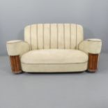 An Art Deco three-piece suite comprising a two seater sofa and his & hers armchairs. A/F. Upholstery