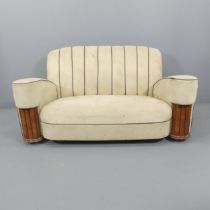 An Art Deco three-piece suite comprising a two seater sofa and his & hers armchairs. A/F. Upholstery