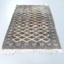 A cream-ground Afghan rug. 135x94cm.