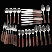 A selection of stainless steel and wooden-handled cutlery, including makers George Butler & Company