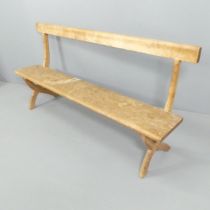 An antique pine bench, with x-shaped supports. 183x90x45cm.