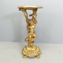 A gilded resin continental Rococo style lamp table, with cherub support. Height 74cm.