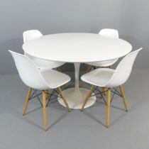 A contemporary Arkana style tulip table, 120x74cm, with four eames style chairs.