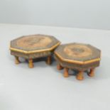 A graduated pair of Indian hardwood octagonal footstools with brass decoration. Largest 32x12cm.