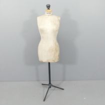 A vintage dressmaker's mannequin on metal stand, labelled Stockman's. Height 161cm