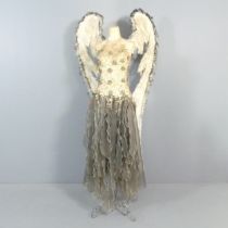 An angel mannequin on metal stand. Height overall 183cm. This is a polystyrene torso on a wire