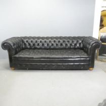 An vintage black leather Chesterfield style sofa. Overall 230x75x95cm, seat 163x42x60cm. Some