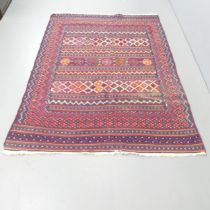A red-ground Persian Kilim rug. 212x155cm.