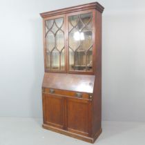 A 19th century mahogany bureau bookcase, with lattice glazed doors, fall front and cupboards