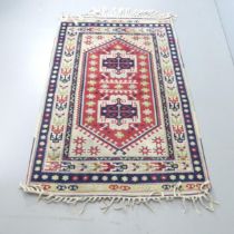 A cream-ground Anatolian rug. 187x118cm.