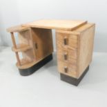 A 1930s Heals style Art Deco limed oak desk with a 3 drawer pedestal and an extended pedestal with