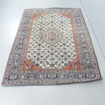 A blue and cream ground Persian rug. 203x145cm.