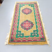 A mustard-ground Mongolian style rug. 200x100cm.