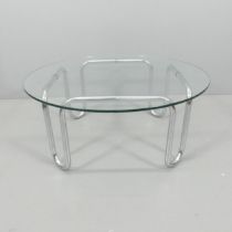 A mid-century circular glass topped coffee table on tubular metal base. 92x39cm. Small chip to