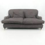 A modern Howards style two-seater sofa. 178x80x110cm, seat 146x46x76cm.