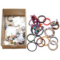A box of various costume jewellery, including Bakelite bangles, mixed necklaces and other bangles,