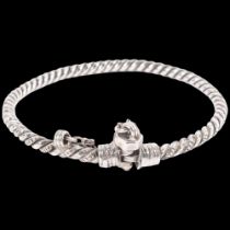 An Eastern white metal torque rope twist bangle, with bolt clasp, W5.8mm, internal diameter 8cm