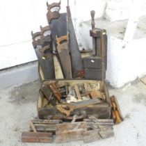 A quantity of antique and vintage hand tools, including saws, box planes etc. Some marked.