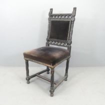 A 19th century Gothic carved oak chair